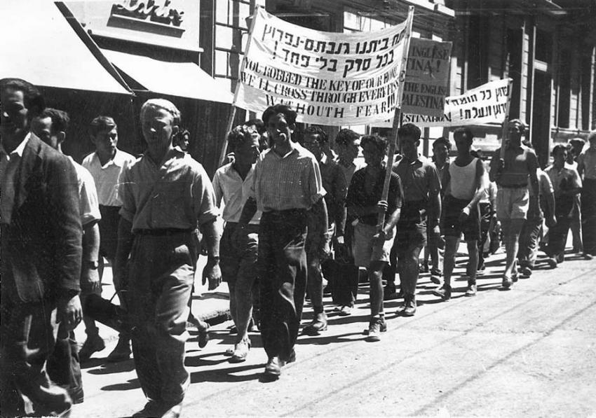Demonstrators holding signs demanding unrestricted immigration to Eretz Israel, pro-Aliyah demonstration, Bari, Italy. The Bari camp housed both Jews and non-Jews.  In July 1947, there were some 780 Jews living there.