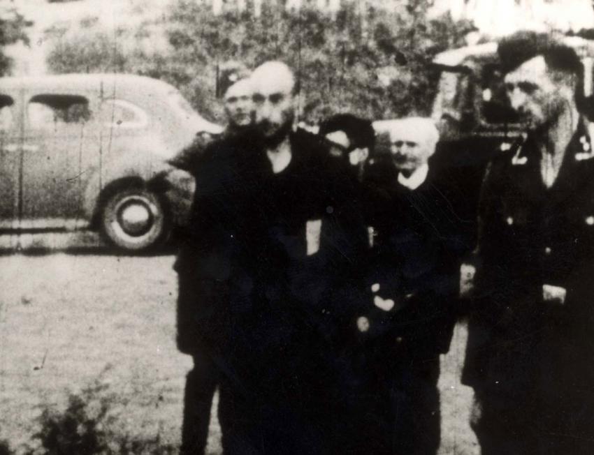 SS sergeant Karlis Siliakoves (right) during the murder of the Jews of Liepāja in the fishing village of Šķēde, Baltic coast, 15 km north of Liepāja, 15-17 December 1941
