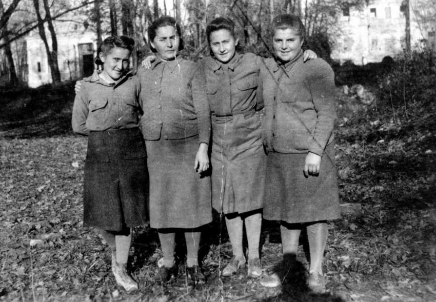 Four Holocaust survivors in Reggio Emilia, Italy, prior to their immigration to Eretz Israel.  There was a Hachshara kibbutz at this camp. LTR: Esther Bialer, her mother Tova, her twin sister Chava (Ben Menachem) and her mother’s sister Rosa Malikont.
