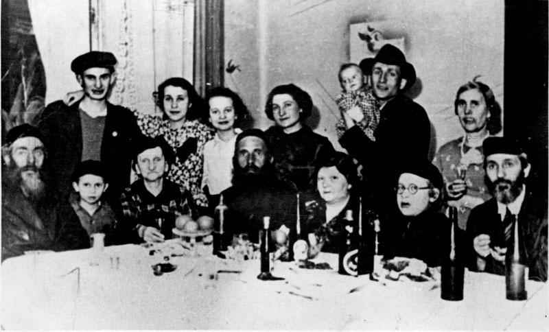 Poland, The Schwartz and Sylberberd families during a Purim meal, 1939
