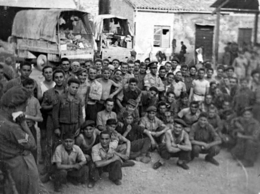 Adolescent Holocaust survivors with Jewish Brigade soldiers after the war