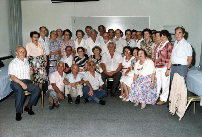 Oswald Rufeisen (center, with a beard) in a group photograph at the annual gathering of ex-Mir residents, 1991