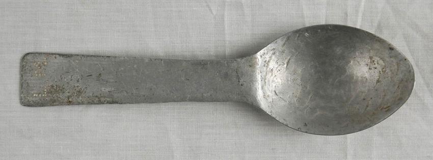 A spoon that was sharpened into a knife, used by Aryeh Mühlrad in the Gusen Concentration Camp. Inscribed on the handle are Aryeh Mühlrad’s initials: L M (Leon Mühlrad)