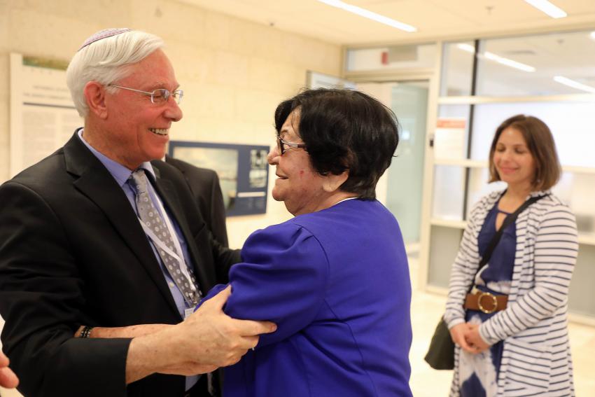 Ephraim Kaye embraces Holocaust survivor Frieda Kliger in the foyer of the Reading Room, Yad Vashem, June 2018