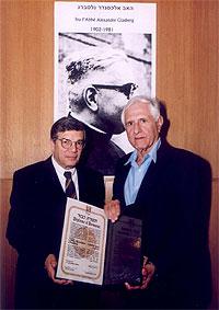  Avner Shalev (l), Chairman of the Yad Vashem Directorate; and IDF Maj. Gen. (Res.) Yossef Geva (r) with Father Glasberg's Certificate of Honor  (Photo credit: Isaac Harari)