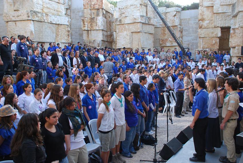 The Collective Youth Movement Group sings the Hatikvah at the conclusion of the ceremony