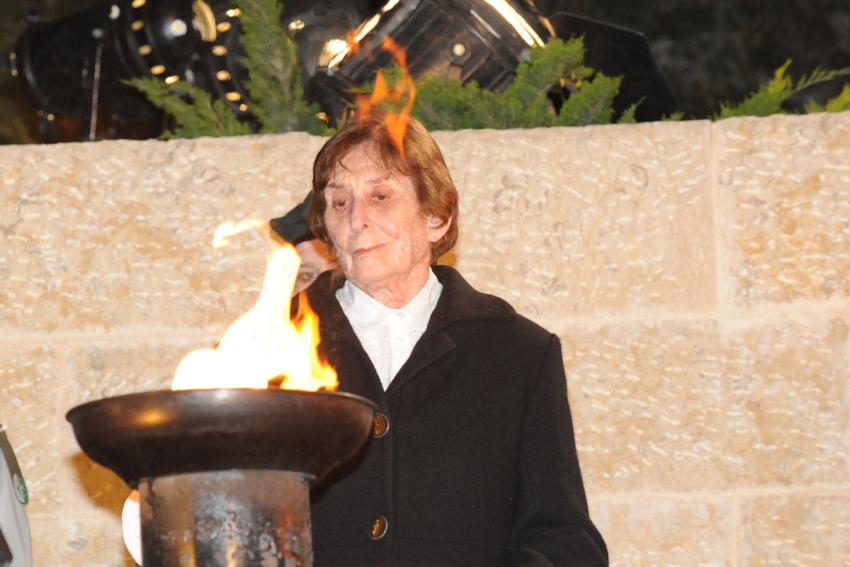 Holocaust survivor Chava Pressburger lights one of the six torches at the ceremony