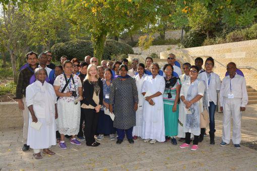 ICEJ Sri Lanka National Director Pastor John Kitto (back row, seventh from left (behind Dr. Susanna Kokkonen) and his group with Dr. Susanna Kokkonen (front row, third from left) at the entrance to the Avenue of the Righteous at Yad Vashem