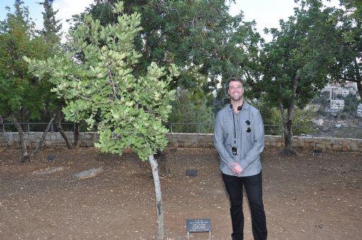 Mike Evans Jr. pictured next to the tree of Corrie ten Boom in the Avenue of the Righteous at Yad Vashem on 06th November, 2016