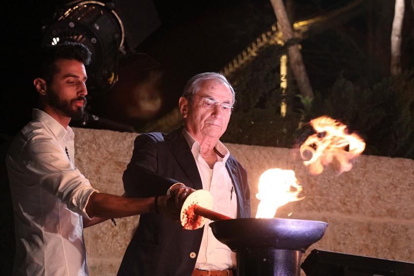 Holocaust survivor Itzchak Biran lights one of the six torches at the ceremony