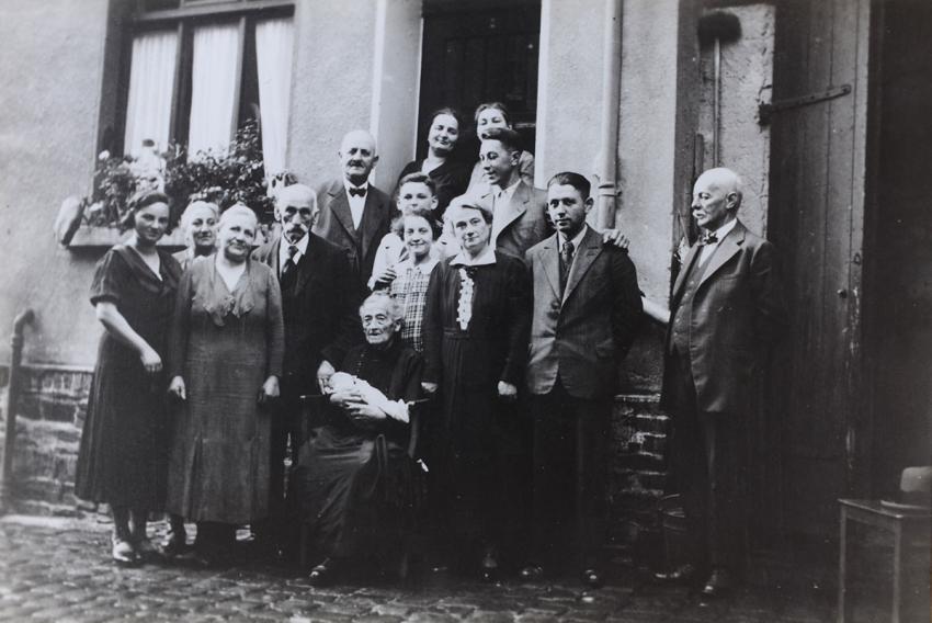 Holegrasch ceremony on the occasion of Ruth Baer's birth.  This naming and blessing ceremony was customary amongst German Jews. Rheinbrohl, Germany, 1938