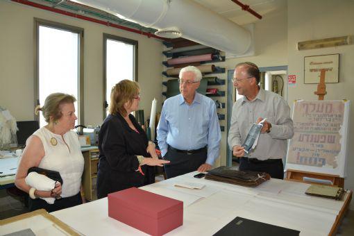 On 29 October, Yad Vashem donors Howard (second from right) and Carole Tanenbaum (left) visited the Yad Vashem Archives, specifically the Photo Preservation Laboratory, donated to Yad Vashem through their generous support