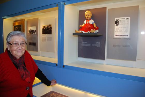 Tzvia Shkolnik standing next to her friend Edit Faber's doll. 