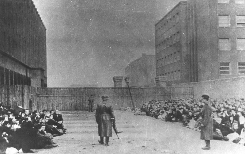 Jews at the Warsaw Umschlagplatz, where they were assembled before being deported to the death camp. 1943.