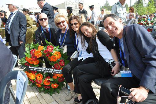 Mark Moskowitz (left) laid a wreath on behalf of the Society with his brother Dan Moskowitz (right) and niece Deena Moskowitz (second from right) during the ceremony in the Warsaw Ghetto Square the morning of Yom Hashoah 2013