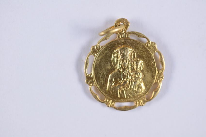 A Christian pendant worn by Marta Winter (Goren) while living under a false identity in Warsaw during the war