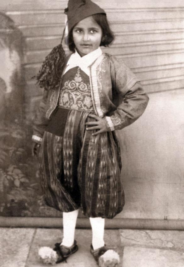 Six year old Rachel-Sarah Osmo dressed up as a Greek freedom fighter, Corfu, Greece