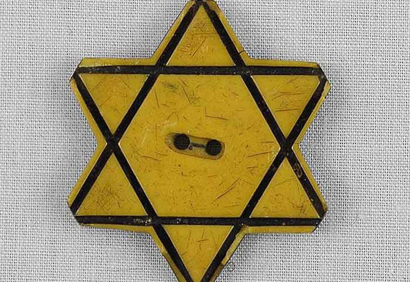 A Yellow Star of David Button