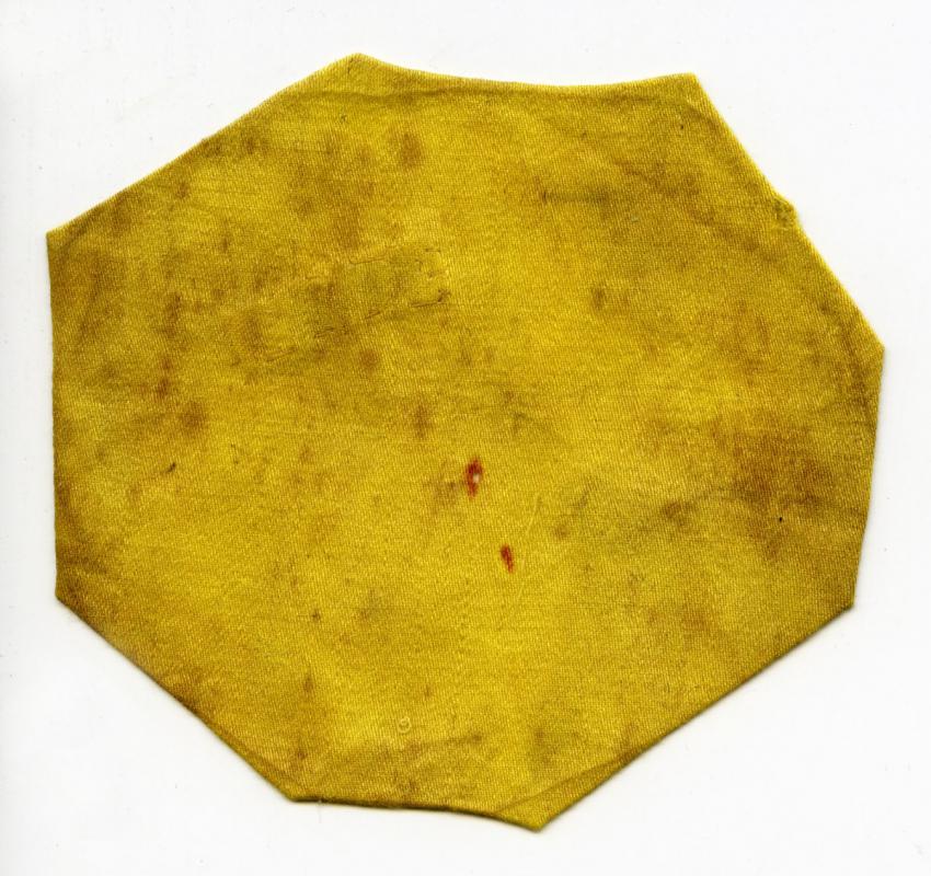 Distinctive Jewish badge (Circular yellow badge) that belonged to Elimelech (Meilech) Lifschitz from the town of Sarny, Ukraine
