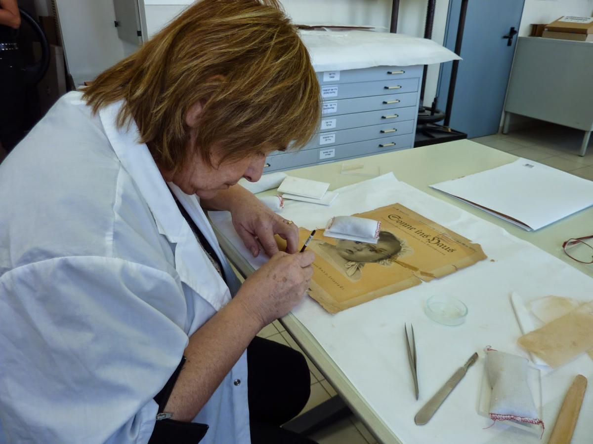 Varda Gross, at work in the Conservation and Restoration Lab at Yad Vashem