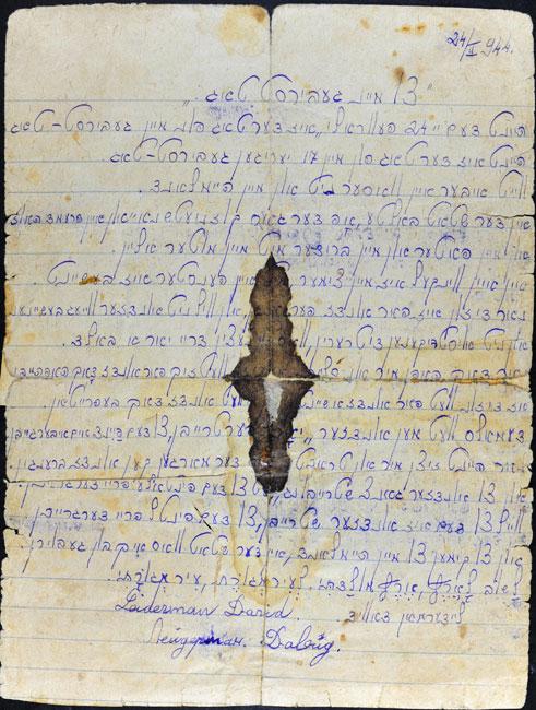 A copy of the birthday message that David's brother Tzvi kept in his pocket. The page is stained with blood from Tzvi's wounds.