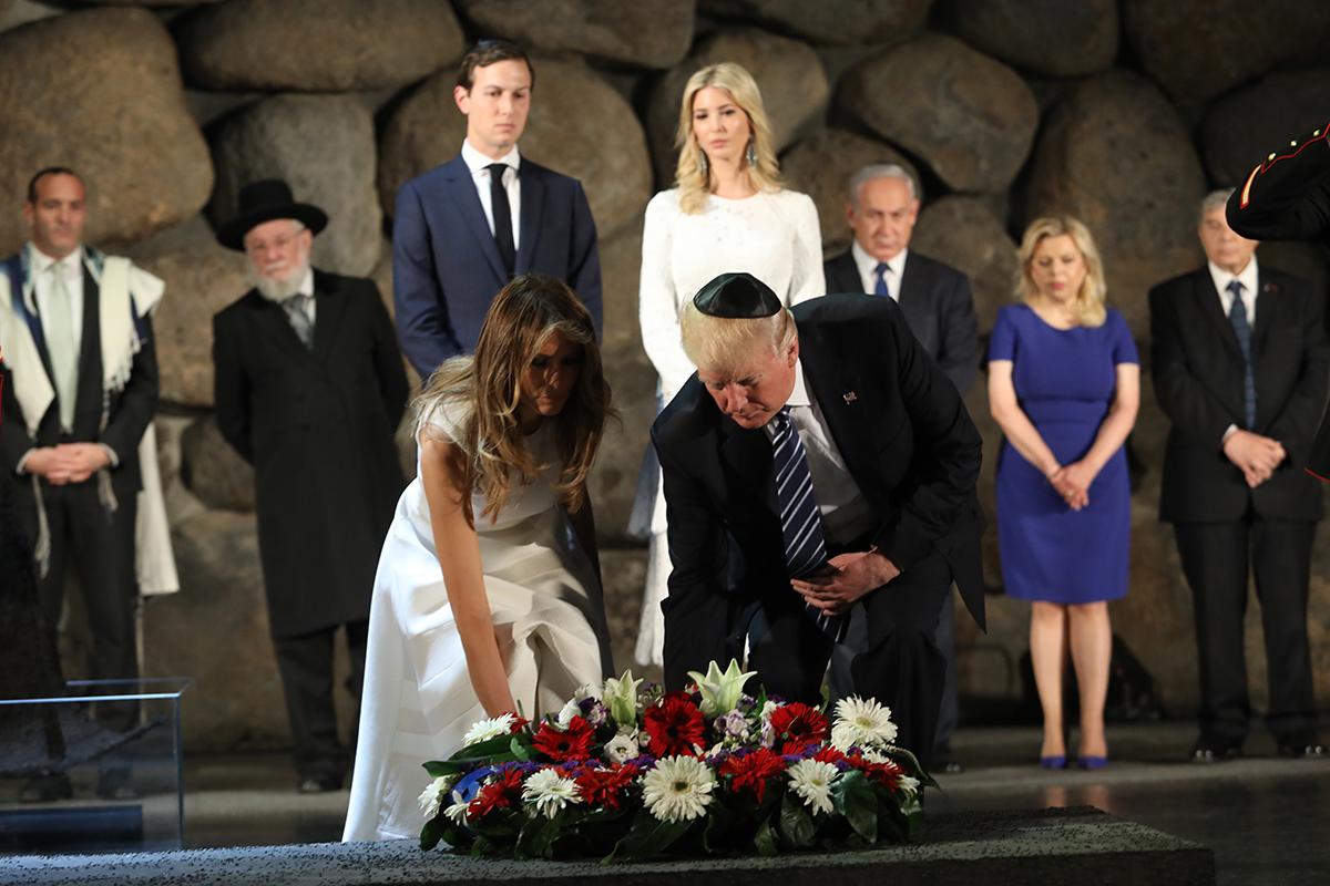 US President Donald Trump and First Lady Melania Trump laying a wreath in the Hall of Remembrance. Also pictured: Cantor Shai Abramson, Rabbi Israel Meir Lau, Jared Kushner, Ivanka Trump, Prime Minister Benjamin Netanyahu and his wife Sara, Avner Shalev