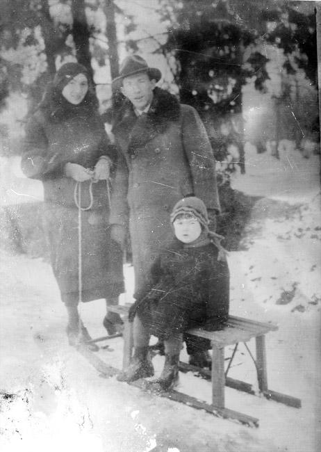 Benjamin on a sled with his parents Miriam and Mendel