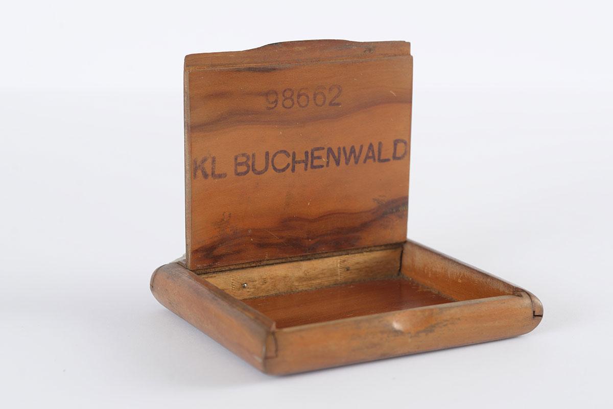 Wooden cigarette box that Alexander (Rosenberg) Ruziak made after his liberation from Buchenwald, stamping it with his prison number and the name of the camp