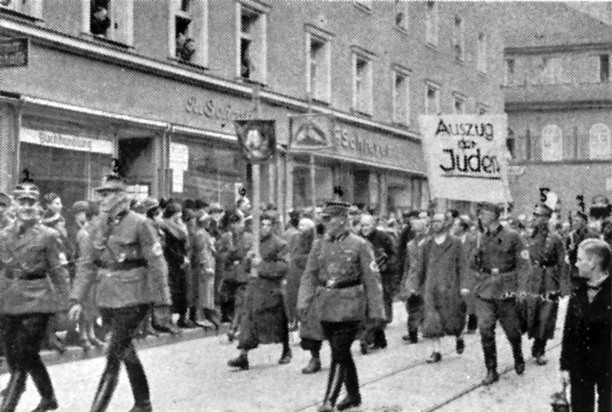 Deportation of the Jews of Regensburg to the Dachau concentration camp on 10 November 1938. The sign reads: &quot;The Deportation of the Jews&quot;.