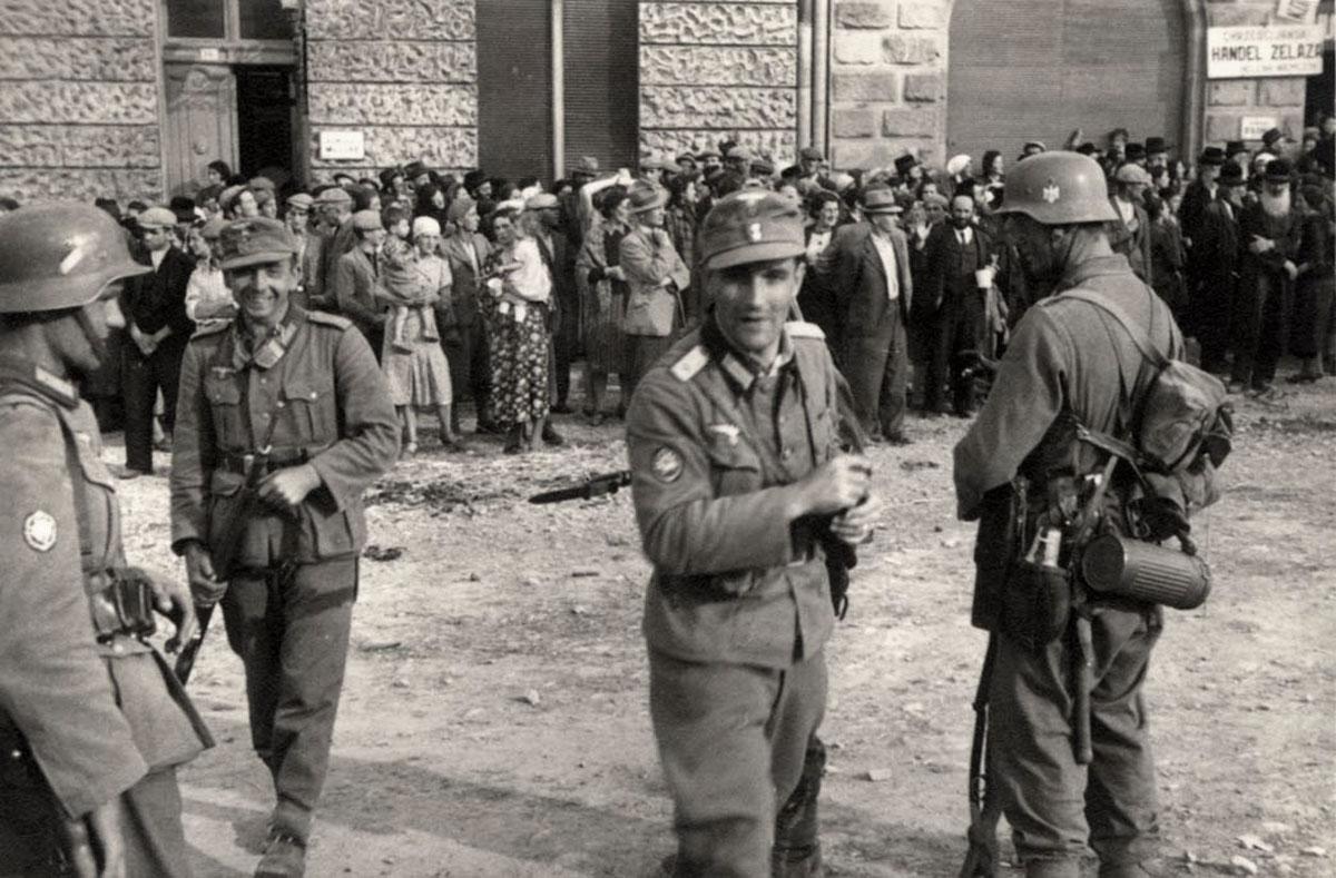 German soldiers guarding a group of Jews in Sanok, Poland, September 1939