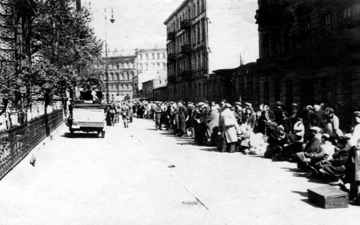 Jews captured during the liquidation of the Warsaw ghetto are gathered at the Umschlagplatz (transfer point) prior to deportation to a death camp