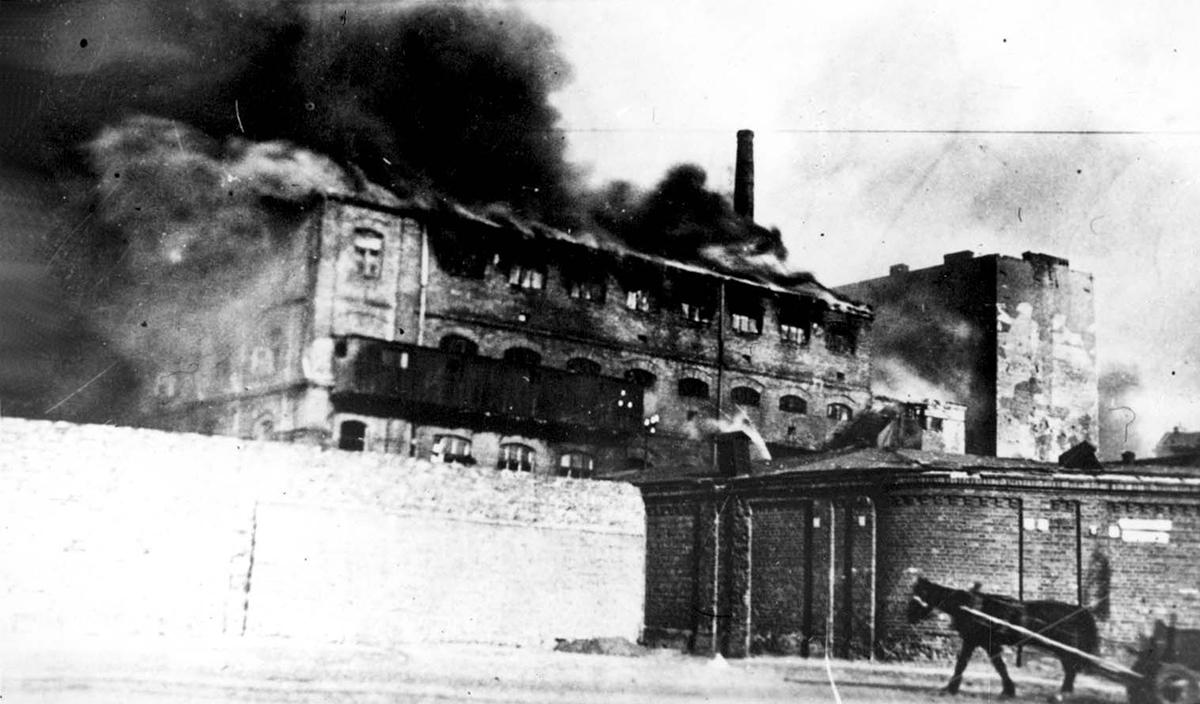 Building in flames inside the Warsaw ghetto, as viewed from the Aryan side