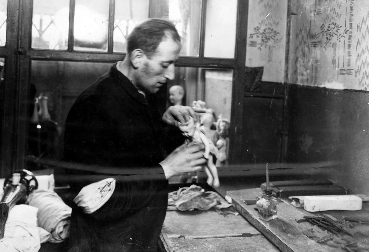 Jewish worker in a workshop that produced dolls, Warsaw ghetto