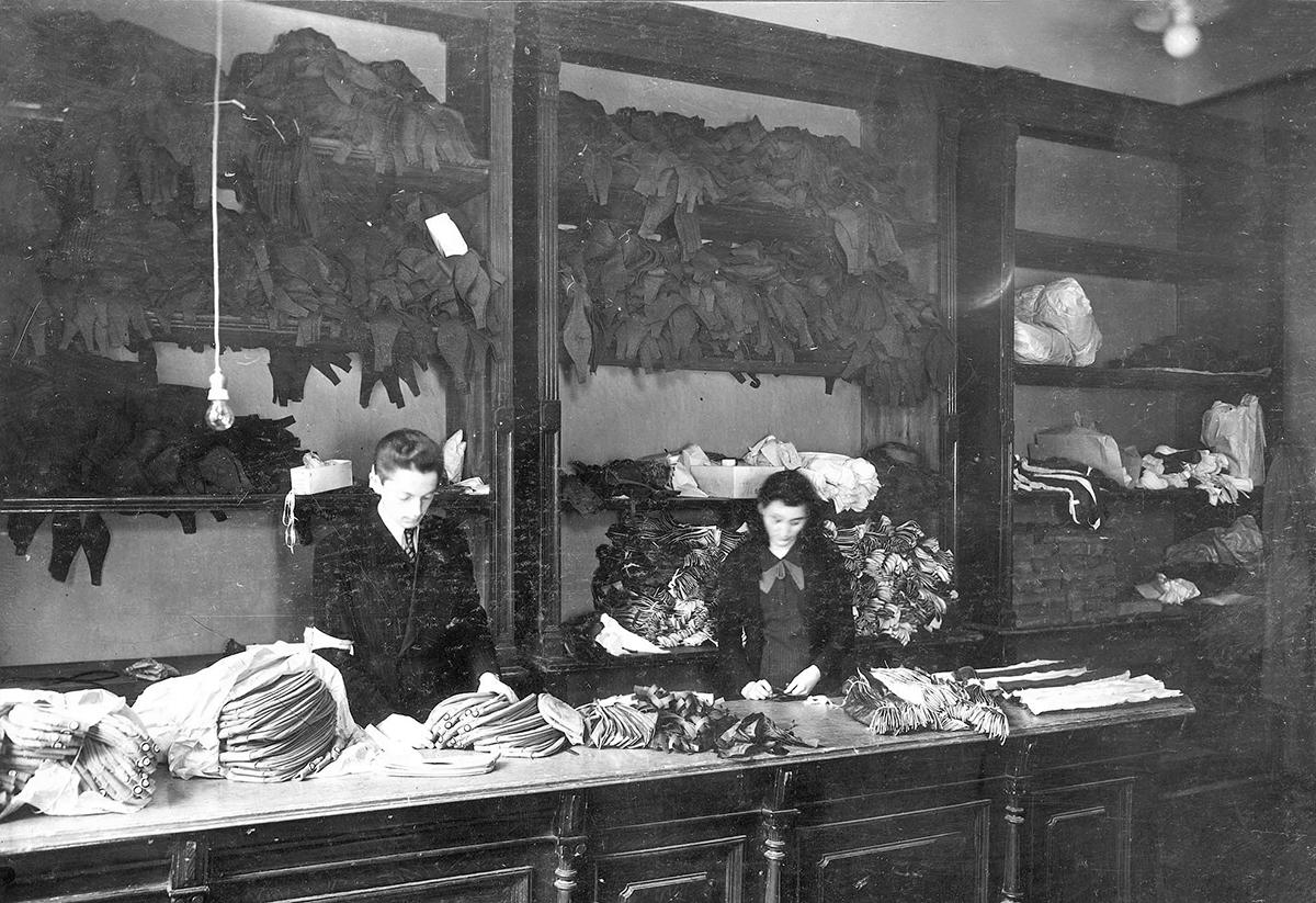 Jewish women sorting clothes in a sewing workshop, Warsaw ghetto