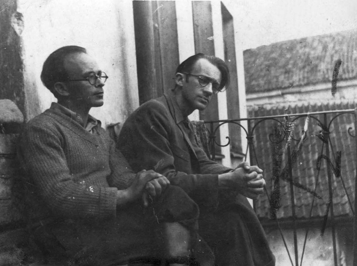 Abraham Sutzkever (right) and Shmerke Kaczerginski outside their apartment in the Vilna ghetto, July 1943