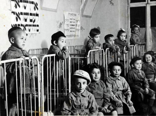 Jewish children in the children's home in Cluj after the war, among them the young twins Eliyahu and Yaakov Malek.