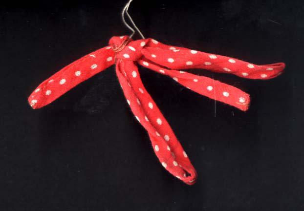 Ribbon from a girl's dress found at the Ponary murder site in 1955
