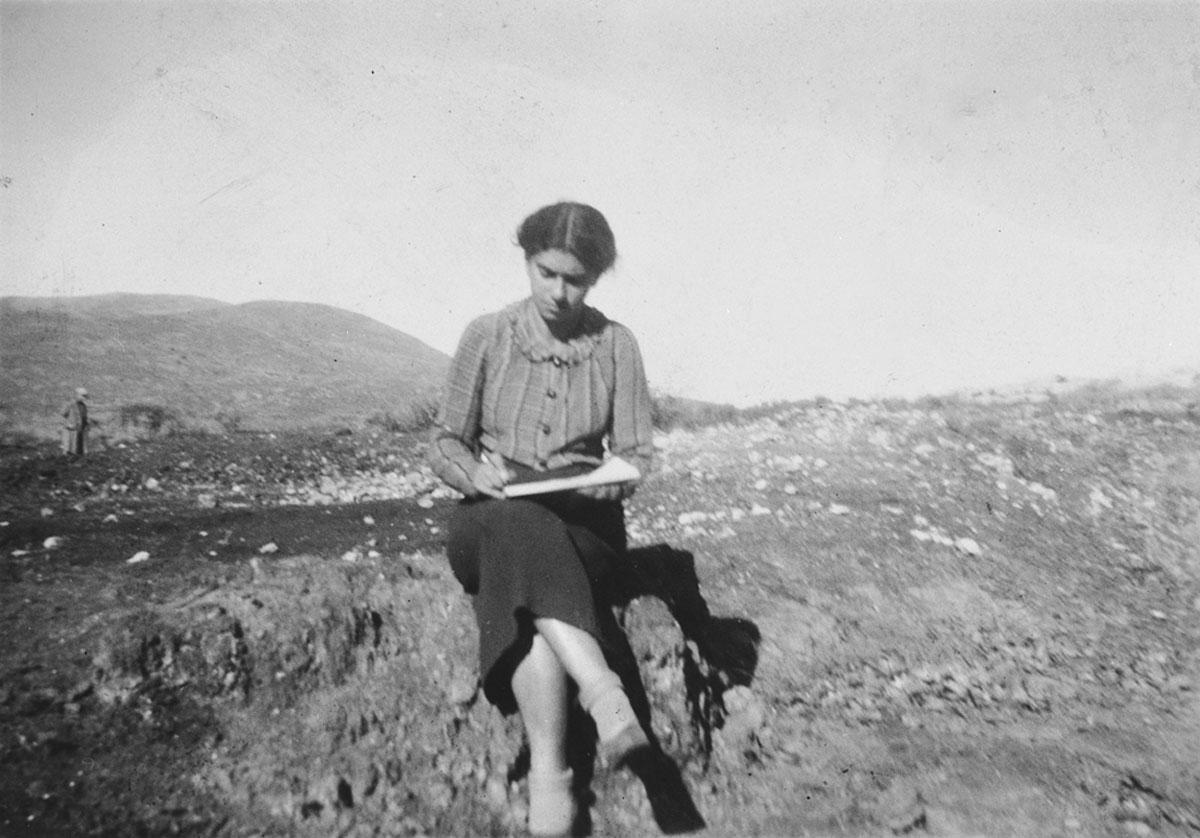 Artist Esther Lurie sketches on the hills outside Kibbutz Beit Alfa in the Galilee, Beit Alfa, Mandatory Palestine, 1938