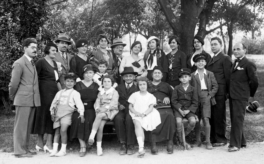 Rivka and Refael Majer surrounded by members of their family, Belgrade, 1935.  Nineteen of the individuals in the photograph were murdered in the Holocaust