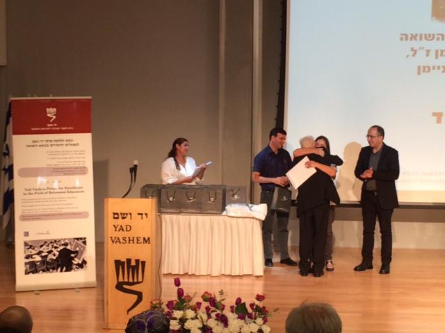 Asher Aud accepting his award from Dorit Novak Director General of Yad Vashem