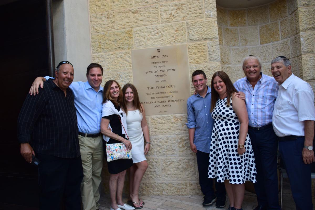  Yad Vashem Pillars Barry and Marilyn Rubenstein (third from left and second from right) attended a ceremony in honor of the Bat Mitzvah of their granddaughter Rachel Altman (fourth from left).