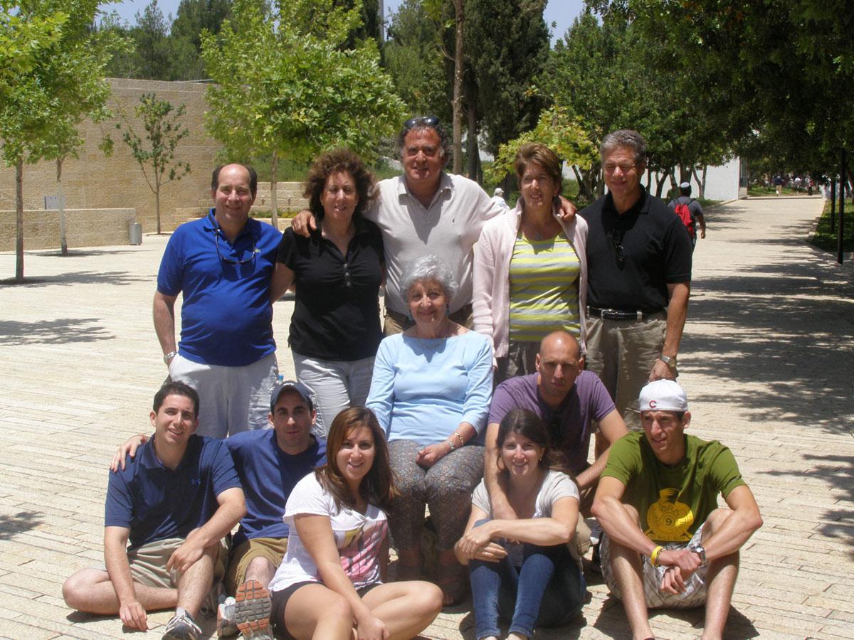 Rochelle Sameroff–Kokotek, who was saved by Roger and Jeanette Voinot in France, with her children and grandchildren, Yad Vashem, June 2010