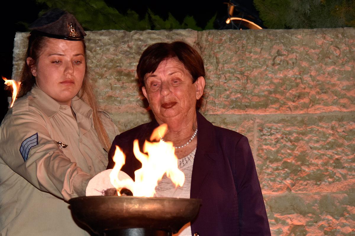 Holocaust survivor Sara Shapira lights one of the six torches at the ceremony