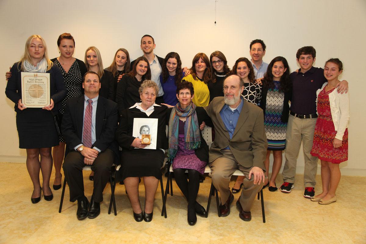 The family of Julia Lakritz saved by Righteous Among the Nations Maria Zurawska, with the rescuer's daughter and granddaughter at award presentation ceremony, Yad Vashem, 16 January 2014