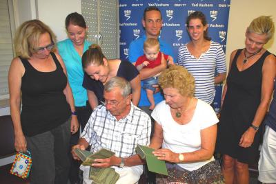 Mosher Hofstadter accompanied by his extended family receiving his father’s books at Yad Vashem
