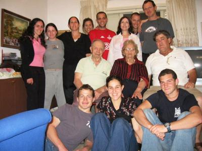 A family reunited: Center row, left to right, Paula and Moshe Eizenberg, Amir Margalit, Front row, center, Nurit Margalit. May 2006 
