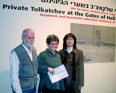 Yehudit Shendar, Senior Curator, Yad Vashem Art Museum (right), together with Tolkatchev&#039;s two children, Ilya and Anel at the opening of the exhibition