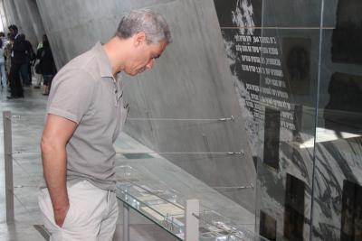 White House Chief of Staff Rahm Emanuel studies an exhibit in the Holocaust History Museum