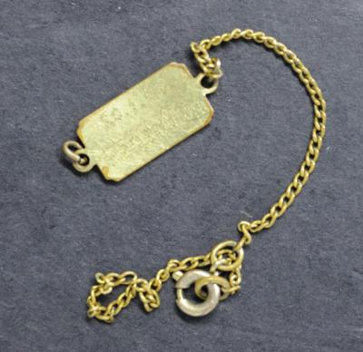 The bracelet engraved with Helenuchka's date of birth 20/1/1940
