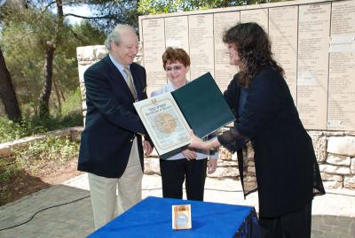 Elisabeth (Lili) Winn-Gessler and Roman Gessler receive the Medal and Certificate of Honor of the Righteous Among the Nations from Ms. Irena Steinfeldt, the Director of the Righteous Among the Nations Department at Yad Vashem